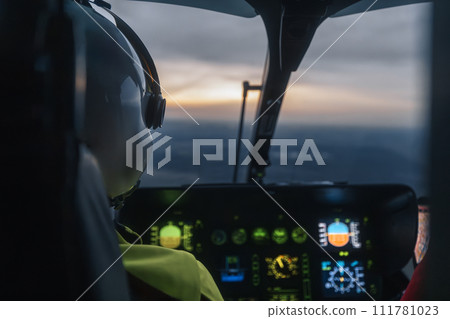 Helicopter emergency medical service flying at dusk. Helicopter emergency medical service flying at dusk. 111781023