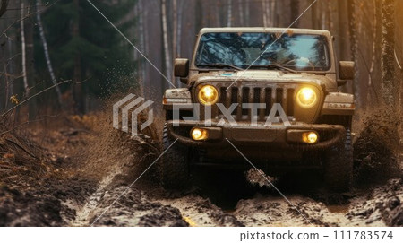Jeep off-roading through the forest in rainy wet weather through mud and high levels of water run-off from the rain storm disaster 111783574