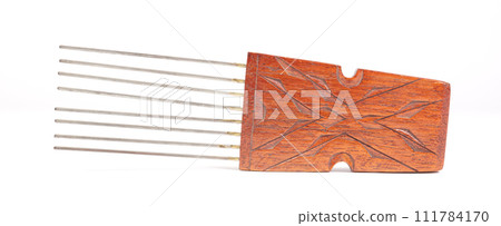 Vintage comb from Suriname, isolated on white Vintage comb from Suriname, isolated on white 111784170