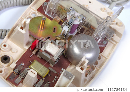 Part of a broken old telephone, phone with dial plate - plastic phone 111784184