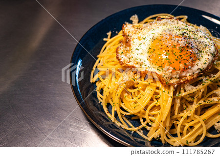 Pasta with fried egg Pasta with fried egg 111785267