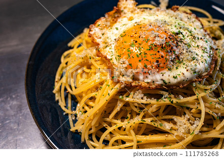 Pasta with fried egg 111785268