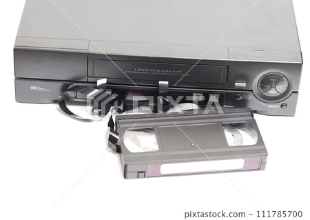 Retro video cassette recorder with VHS cassette with unwound tape isolated on white background. 111785700
