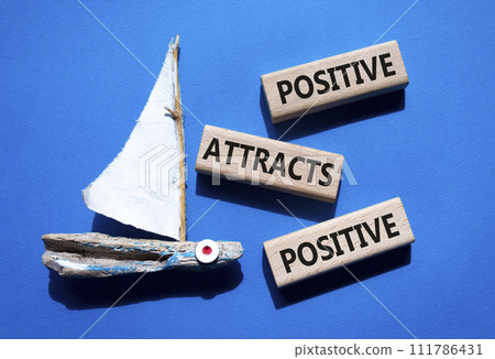 Positive attracts Positive symbol. Wooden blocks with words Positive attracts Positive. Beautiful blue background with boat. Business and Positive attracts Positive concept. Copy space. Positive attracts Positive symbol. Wooden blocks with words Positive attracts Positive. Beautiful blue background with boat. Business and Positive attracts Positive concept. Copy space. 111786431