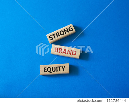 Strong Brand Equity symbol. Concept words Strong Brand Equity on wooden blocks. Beautiful blue background. Business and Strong Brand Equity concept. Copy space 111786444