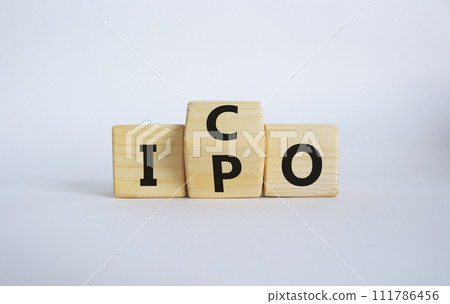ICO and IPO symbol. Wooden cubes with words ICO - initial coin offering and IPO - initial public offering. Beautiful white background. Business concept. Copy space 111786456