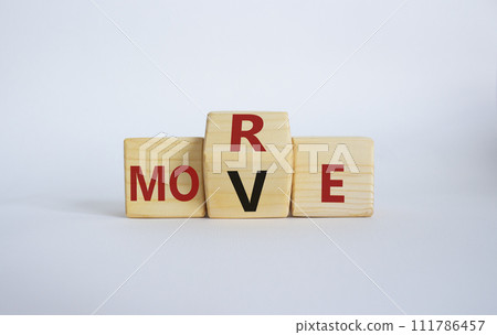 More Move symbol. Wooden cubes with words More Move. Beautiful white background. Business concept and More Move. Copy space More Move symbol. Wooden cubes with words More Move. Beautiful white background. Business concept and More Move. Copy space 111786457