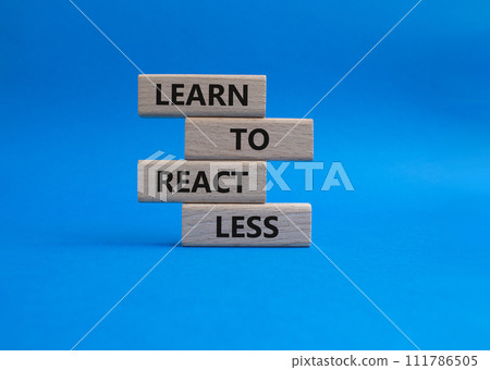 Learn to react Less symbol. Wooden blocks with words Learn to react Less. Businessman hand. Beautiful blue background. Business and Learn to react Less. Copy space. 111786505