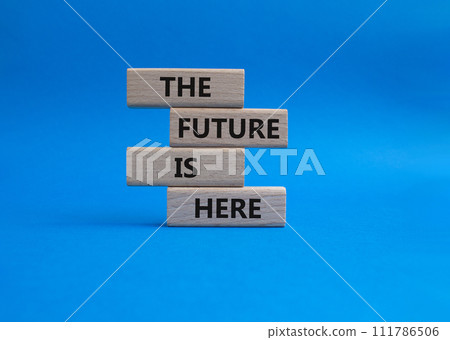 The future is here symbol. Concept words The future is here on wooden blocks. Beautiful blue background. Business and The future is here concept. Copy space. The future is here symbol. Concept words The future is here on wooden blocks. Beautiful blue background. Business and The future is here concept. Copy space. 111786506