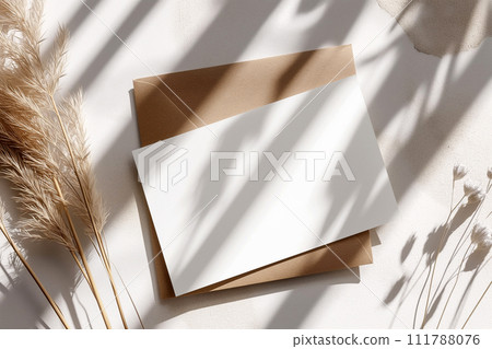 Wedding invitation mockup. Blank template for design or product placement. Blank card on neutral background with flowers. Elegant wedding flat lay composition Wedding invitation mockup. Blank template for design or product placement. Blank card on neutral background with flowers. Elegant wedding flat lay composition 111788076