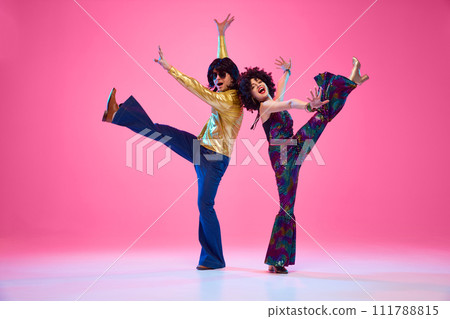 Full length portrait of talented people, dancers duo energetically moves against gradient pink studio background. 111788815