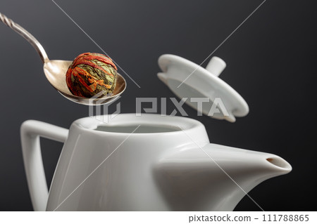 Chinese green tea ball with marigold (calendula) flowers. 111788865