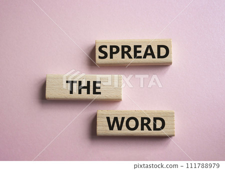 Spread the Word symbol. Concept words Spread the Word on wooden blocks. Beautiful pink background. Business and Spread the Word concept. Copy space. 111788979