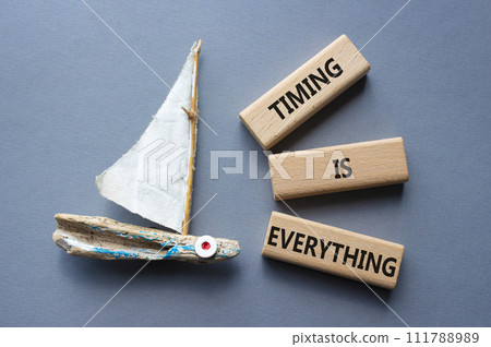 Timing is Everything symbol. Wooden blocks with words Timing is Everything. Beautiful grey background with boat. Business and Timing is Everything concept. Copy space. Timing is Everything symbol. Wooden blocks with words Timing is Everything. Beautiful grey background with boat. Business and Timing is Everything concept. Copy space. 111788989