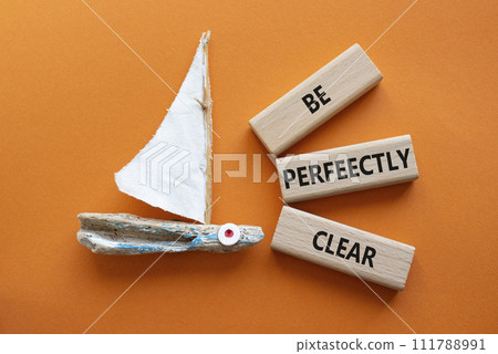 Be perfectly clear symbol. Concept words Be perfectly clear on wooden blocks. Beautiful orange background with boat. Business and Be perfectly clear concept. Copy space Be perfectly clear symbol. Concept words Be perfectly clear on wooden blocks. Beautiful orange background with boat. Business and Be perfectly clear concept. Copy space 111788991