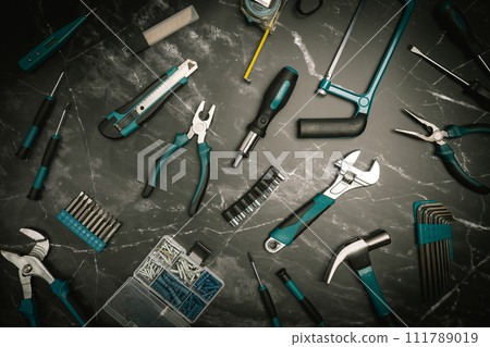 Set of tools on black marble background, 111789019