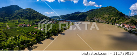 Panorama of Wachau valley with Danube river near Duernstein village in Lower Austria. Traditional wine and tourism region, Danube cruises. Panorama of Wachau valley with Danube river near Duernstein village in Lower Austria. Traditional wine and tourism region, Danube cruises. 111789036