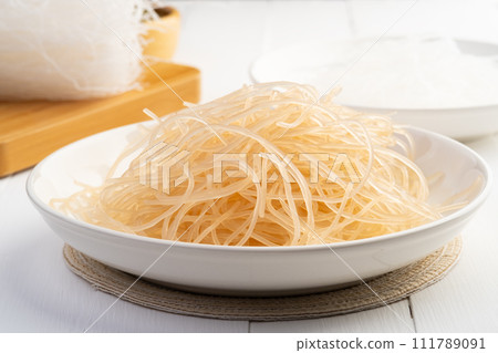 Fresh korean glass noodles in white plate,Korean and Japanese glass noodles are typically made from sweet potato starch 111789091