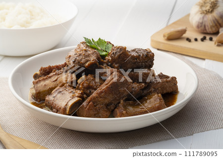 Braised pork spare ribs with soy sauce in white plate 111789095