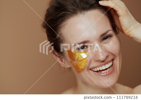 smiling young female with eye patches smiling young female with eye patches 111789218