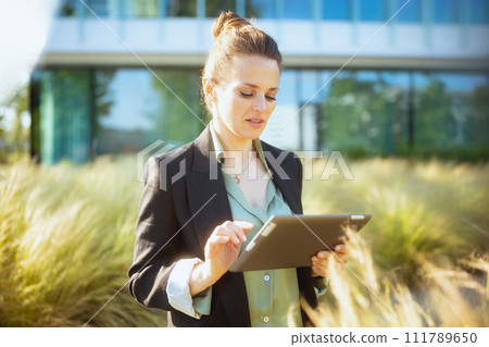 pensive modern woman employee near business center pensive modern woman employee near business center 111789650