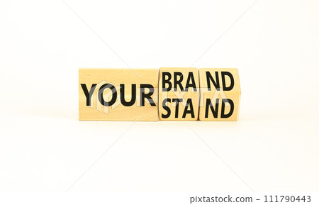 Branding your brand or stand symbol. Concept words Your stand Your brand on beautiful blocks. Beautiful white table white background. Business branding your brand or stand concept. Copy space. Branding your brand or stand symbol. Concept words Your stand Your brand on beautiful blocks. Beautiful white table white background. Business branding your brand or stand concept. Copy space. 111790443