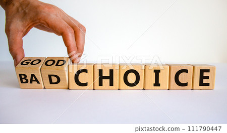 Good or bad choice symbol. Businessman turns wooden cubes and changes words 'bad choice' to 'good choice'. Beautiful white background, copy space. Business and good choice concept. Good or bad choice symbol. Businessman turns wooden cubes and changes words 'bad choice' to 'good choice'. Beautiful white background, copy space. Business and good choice concept. 111790447