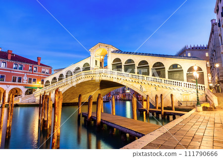 Famous Rialto Bridge of Venice on the Grand Canal at twilight, Italy. Famous Rialto Bridge of Venice on the Grand Canal at twilight, Italy. 111790666