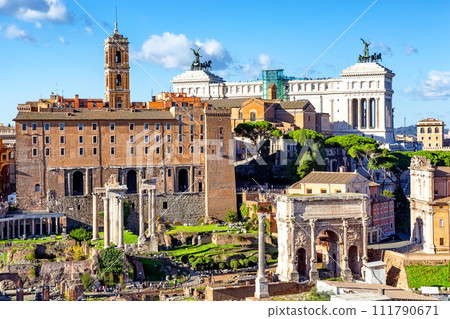 Ruins of the Roman Forum with the Capitolium and National Monument to Victor Emmanuel II in the background in Rome, Italy. Ruins of the Roman Forum with the Capitolium and National Monument to Victor Emmanuel II in the background in Rome, Italy. 111790671