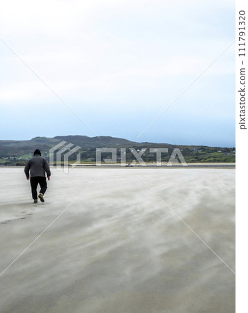 Sand storm at Dooey beach by Lettermacaward in County Donegal - Ireland 111791320