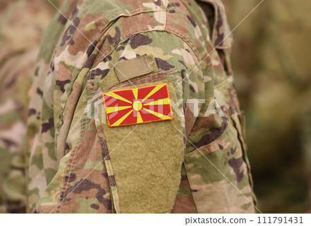 Macedonia (former Yugoslav Republic of Macedonia) flag on soldiers arm (collage). Macedonia (former Yugoslav Republic of Macedonia) flag on soldiers arm (collage). 111791431
