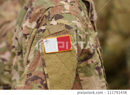 Flag of Malta on soldiers arm. Flag of Malta on military uniforms (collage). Flag of Malta on soldiers arm. Flag of Malta on military uniforms (collage). 111791436