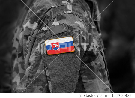 Flag of Slovakia on soldiers arm (collage). 111791485