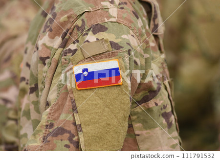 Flag of Slovenia on soldiers arm (collage). 111791532