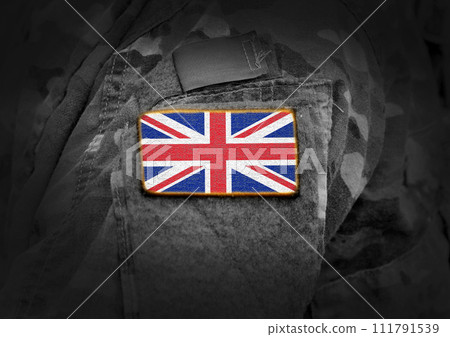 Flag of United Kingdom on soldiers arm. Flag of UK on military uniforms (collage). 111791539