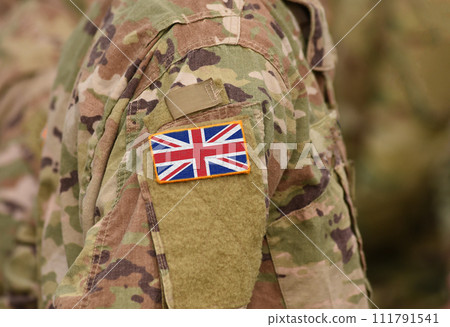 Flag of United Kingdom on soldiers arm. Flag of UK on military uniforms (collage). 111791541