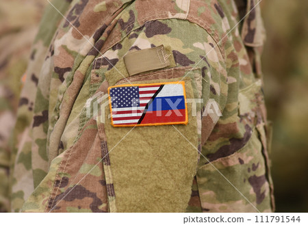 Albania flag on soldiers arm (collage). 111791544