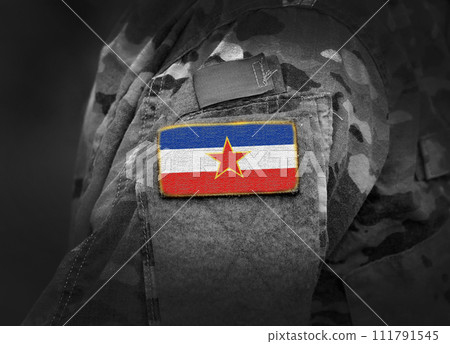 Yugoslavia flag on soldiers arm (collage). 111791545