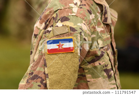 Yugoslavia flag on soldiers arm (collage). 111791547