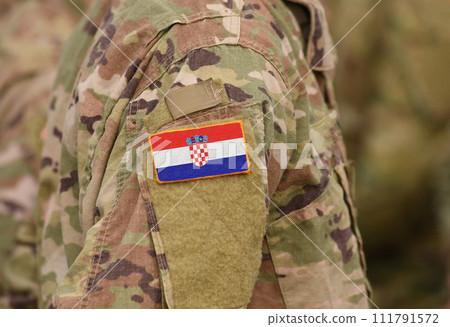 Flag of Croatia on soldiers arm (collage). Flag of Croatia on soldiers arm (collage). 111791572