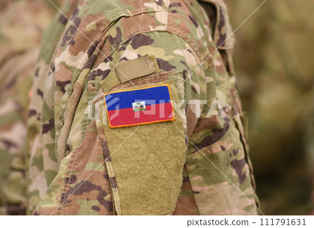 Flag of Haiti on soldier arm. Flag of Haiti on military uniforms (collage). 111791631