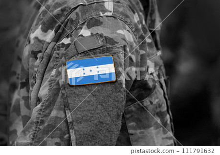 Flag of Honduras on soldier arm. Flag of Honduras on military uniforms (collage). 111791632