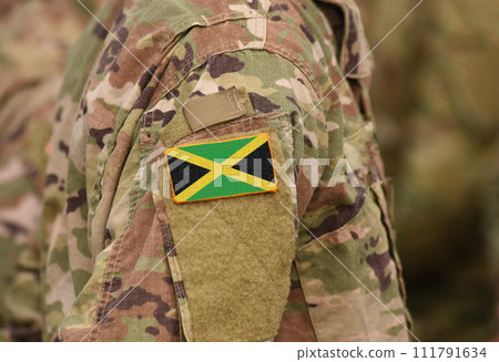 Flag of Jamaica on soldier arm. Flag of Jamaica on military uniforms (collage). Flag of Jamaica on soldier arm. Flag of Jamaica on military uniforms (collage). 111791634