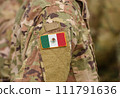 Mexico flag on soldiers arm (collage). 111791636