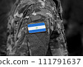 Flag of Nicaragua on soldier arm. Flag of Nicaragua on military uniforms (collage). 111791637