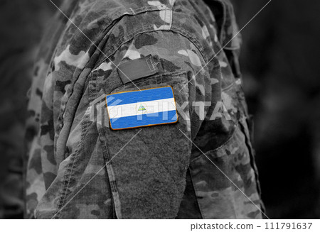 Flag of Nicaragua on soldier arm. Flag of Nicaragua on military uniforms (collage). Flag of Nicaragua on soldier arm. Flag of Nicaragua on military uniforms (collage). 111791637