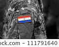 Flag of Paraguay on soldier arm. Flag of Paraguay on military uniforms (collage). 111791640