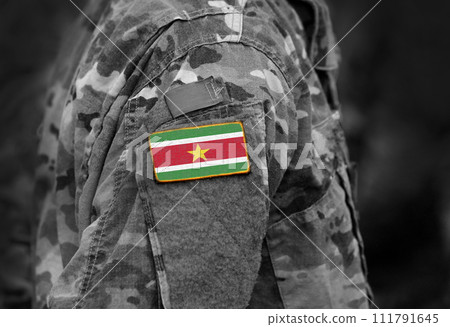 Flag of Suriname on soldier arm. Flag of Suriname on military uniforms (collage). Flag of Suriname on soldier arm. Flag of Suriname on military uniforms (collage). 111791645