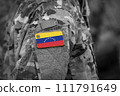 Flag of Venezuela on soldiers arm (collage). 111791649