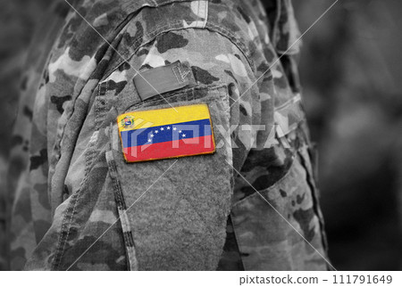 Flag of Venezuela on soldiers arm (collage). 111791649